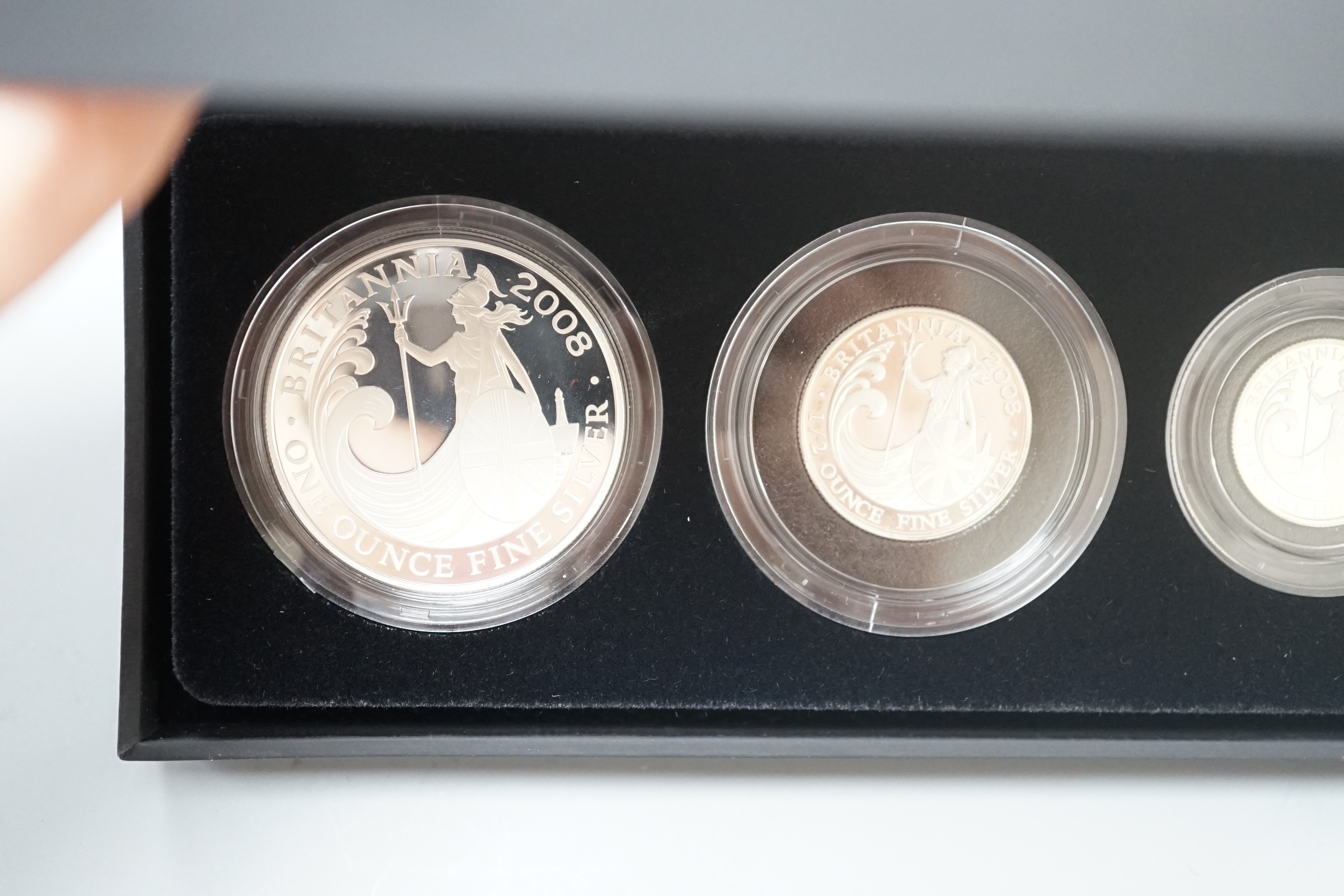Two cased Royal Mint Britannia silver proof four coin sets, 2005 and 2008, 20p to £2
